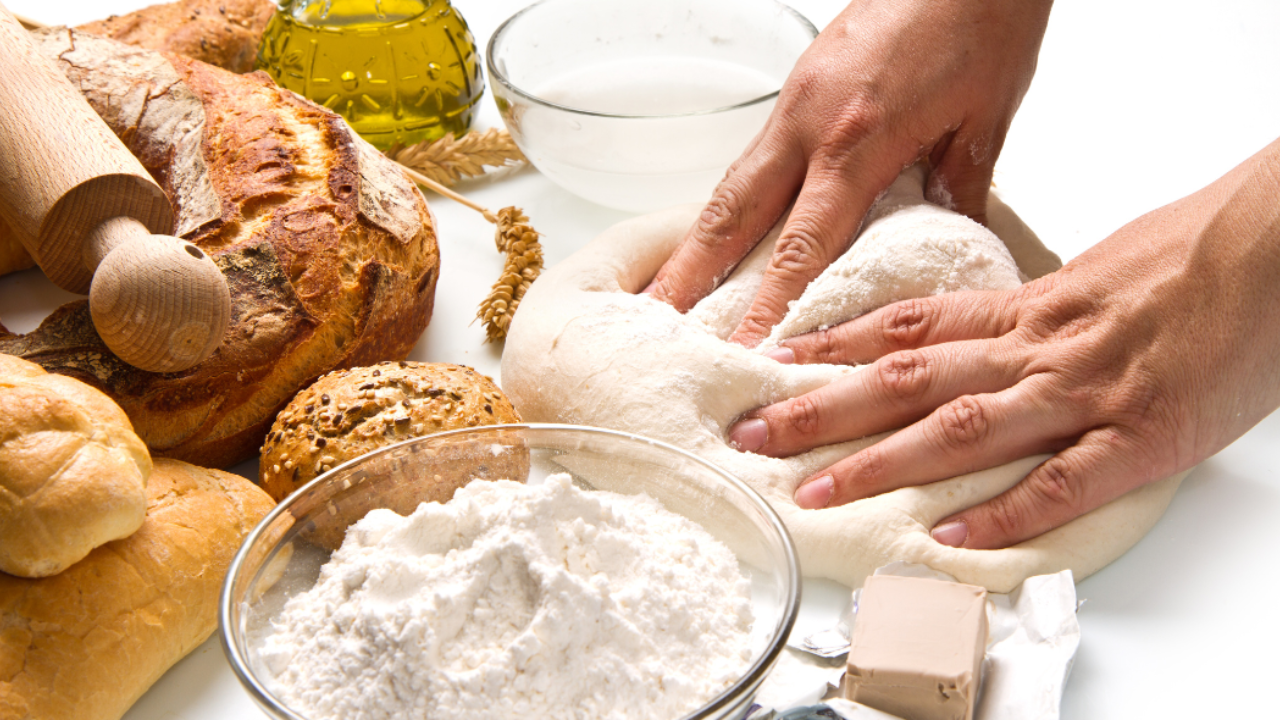 Hands making homemade bread, highlighting carbohydrate choices for reversing type 2 diabetes