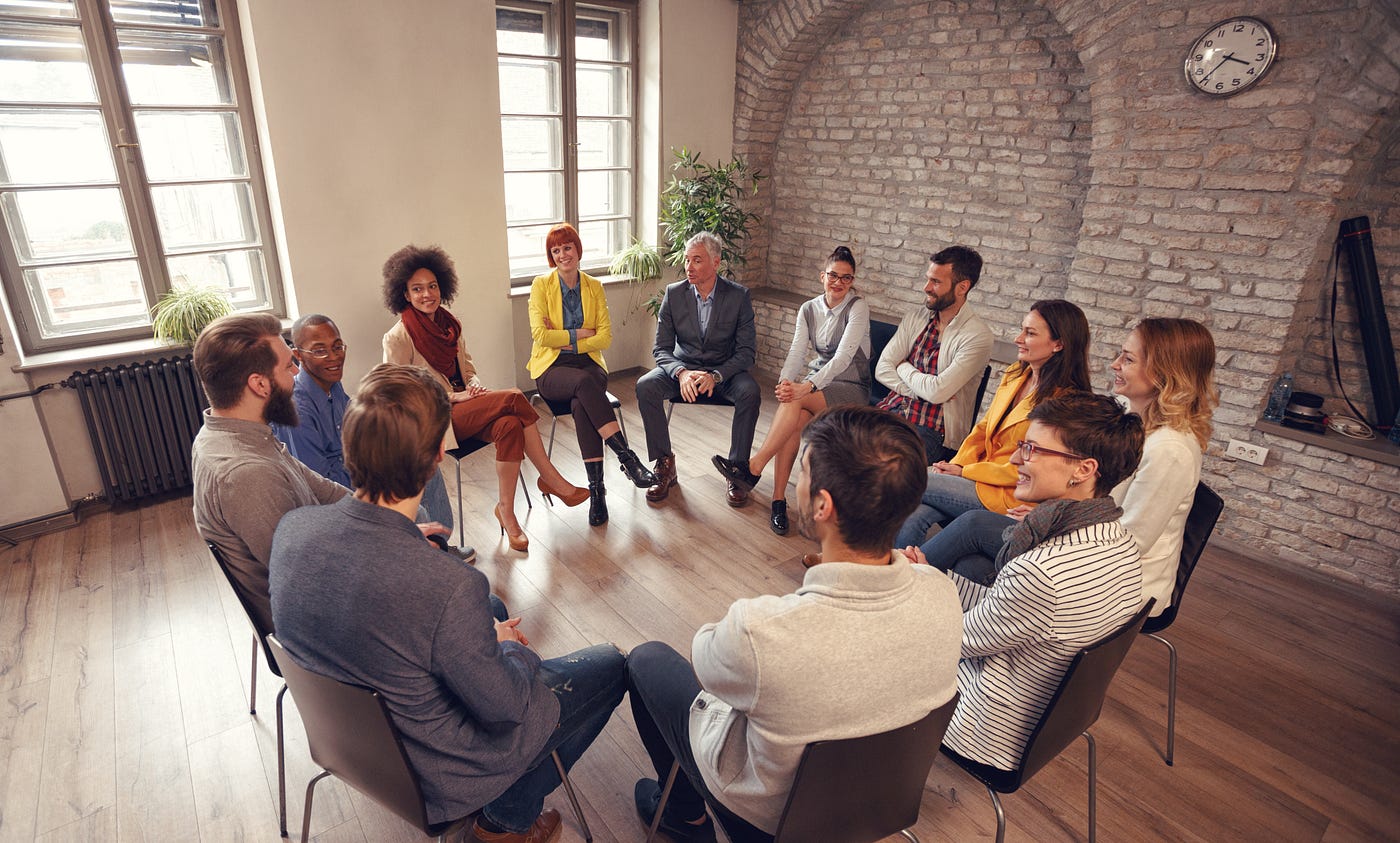 People sitting in a circle providing peer support for managing type 2 diabetes