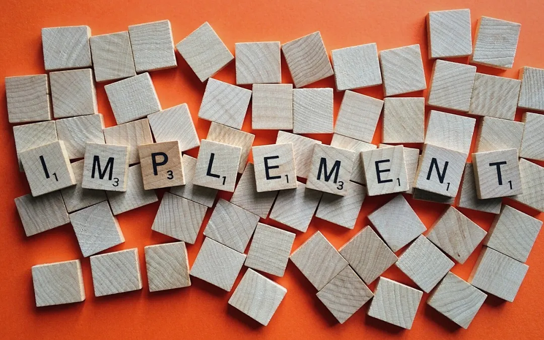 Tiles with the word ‘Implement’ symbolising taking action to reverse type 2 diabetes and improve insulin resistance