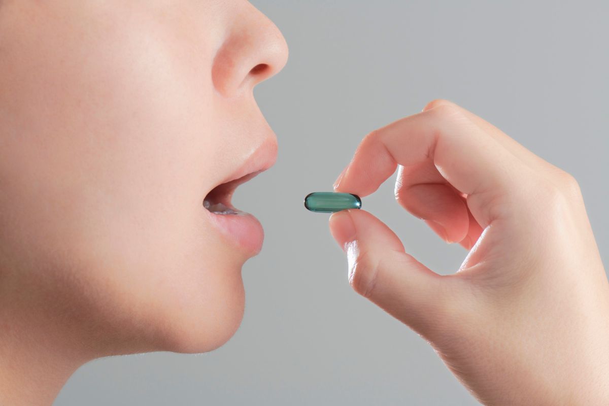 Woman taking diabetes medication as part of balanced lifestyle management