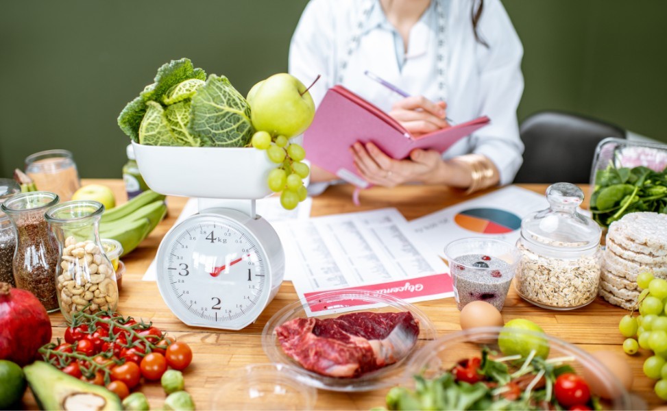 Woman planning meals and tracking diet to reverse type 2 diabetes through lifestyle changes